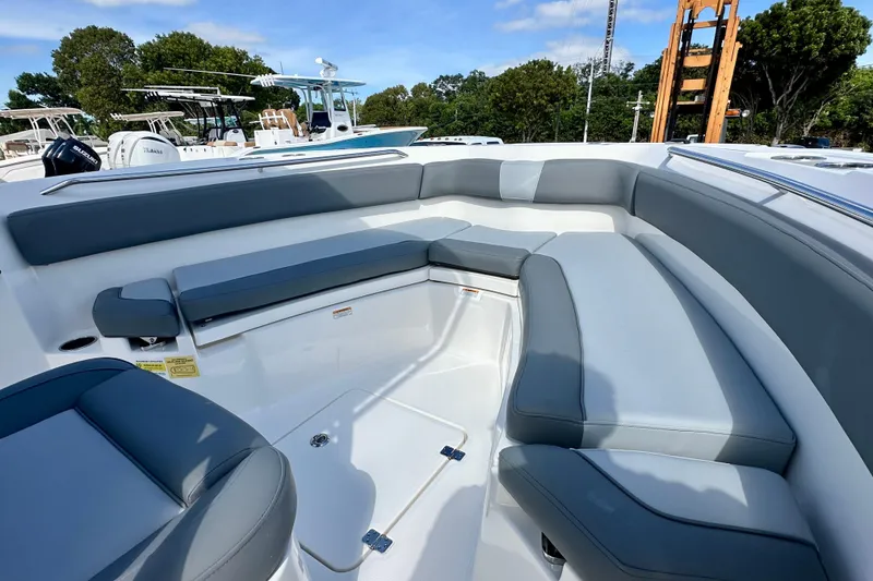 Slide: The Image of 2024 NauticStar 222 Offshore boat interior with gray seating and spacious layout. - 7