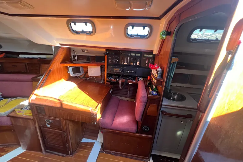 Slide: The Image of Interior of 1987 Hunter Legend 37 sailboat with navigation station and galley. - 10
