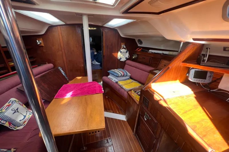Slide: The Image of Interior of 1987 Hunter Legend 37 sailboat with wooden furnishings and cozy seating. - 11