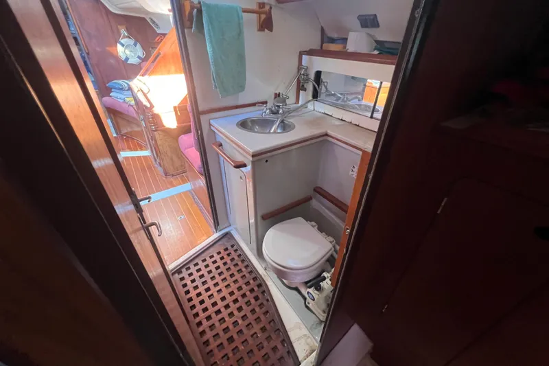 Slide: The Image of Interior of 1987 Hunter Legend 37 sailboat bathroom with sink and toilet. - 17
