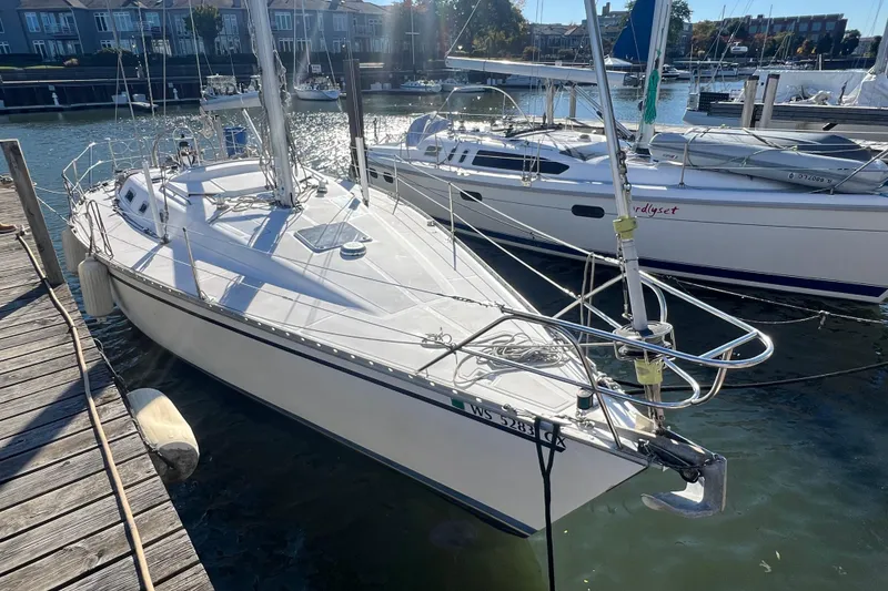 Slide: The Image of 1987 Hunter Legend 37 sailboat docked at marina, sunny day, calm waters. - 3