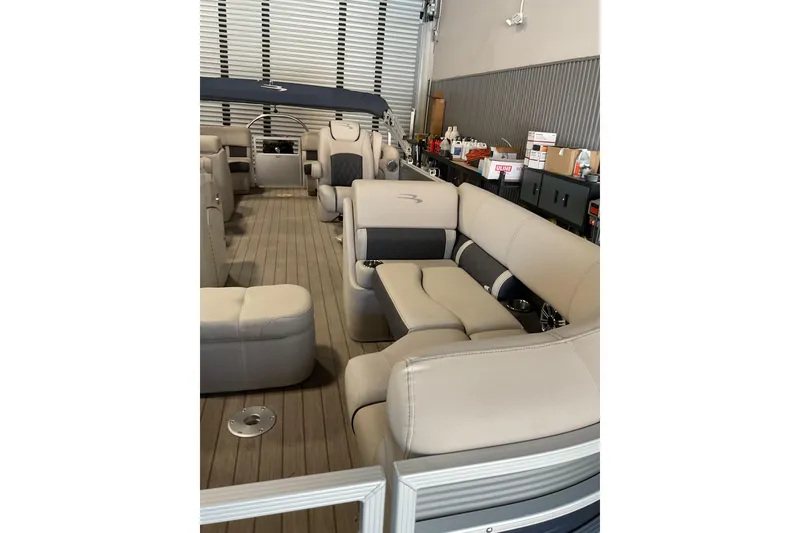 Slide: The Image of 2019 Bennington SX 23 SSRXP pontoon boat interior with plush seating and modern design. - 6