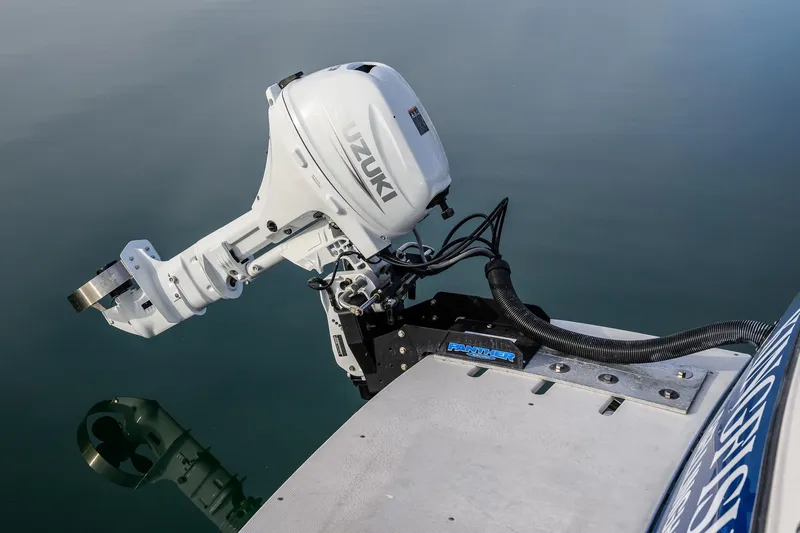 Slide: The Image of Control lever on 2012 Aspen C90 boat, with water reflection in the background. - 11