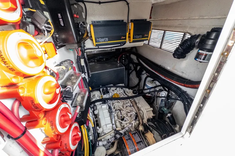 Slide: The Image of Engine compartment of a 2012 Aspen C90 with electrical components and wiring. - 13