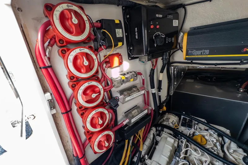 Slide: The Image of Engine compartment of a 2012 Aspen C90 boat, showing batteries and wiring. - 14