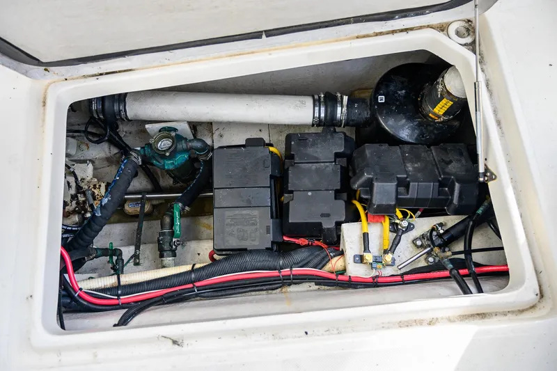 Slide: The Image of Storage compartment in 2012 Aspen C90 boat with equipment and supplies. - 15