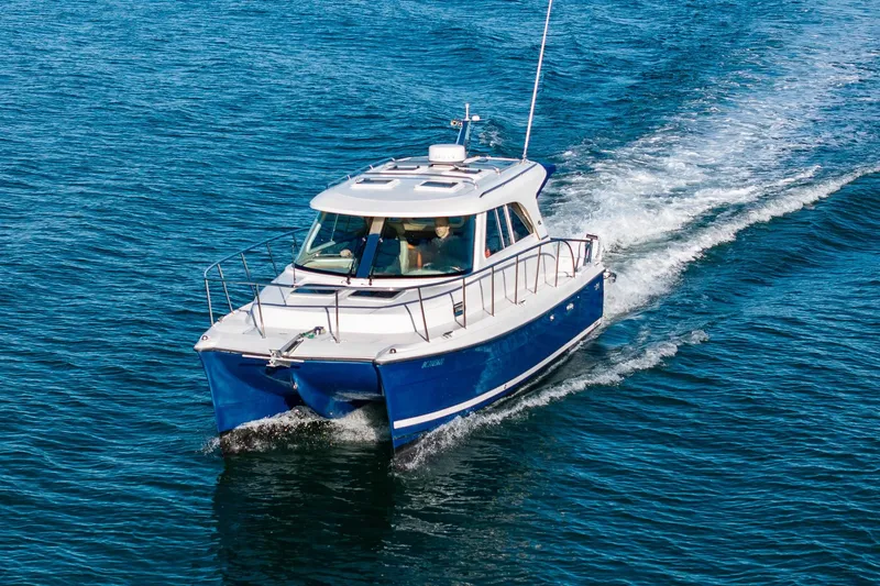 Slide: The Image of 2012 Aspen C90 boat cruising on open blue water. - 2