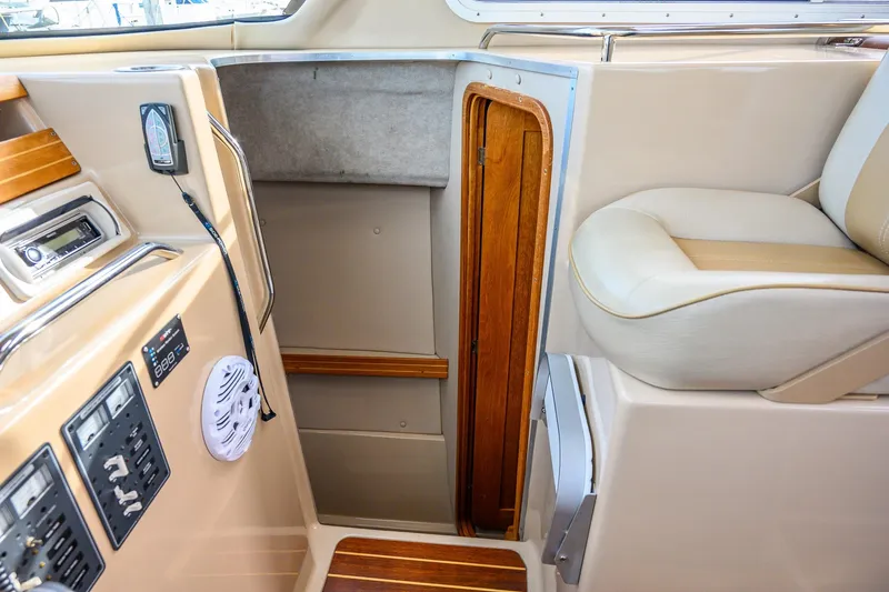 Slide: The Image of Cozy cabin interior of 2012 Aspen C90 boat with wood accents and skylights. - 31