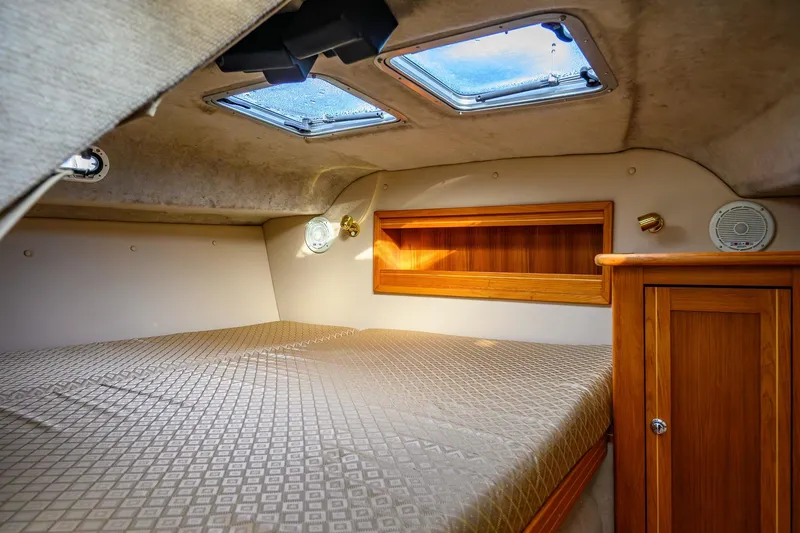 Slide: The Image of Aspen C90 2012 boat bathroom with wooden cabinetry and compact design. - 32