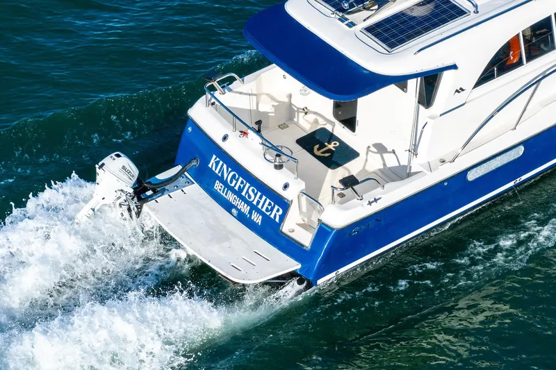 Slide: The Image of Aerial view of 2012 Aspen C90 boat cruising on blue water. - 8
