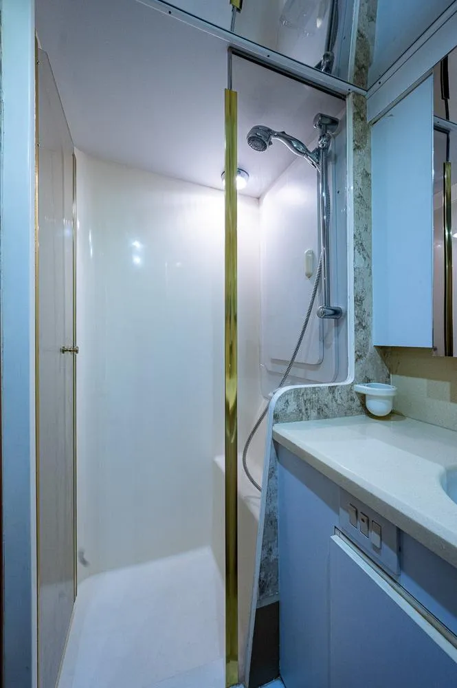 Slide: The Image of Bathroom interior of 1999 Ocean Yachts 60 Convertible with shower and vanity. - 34