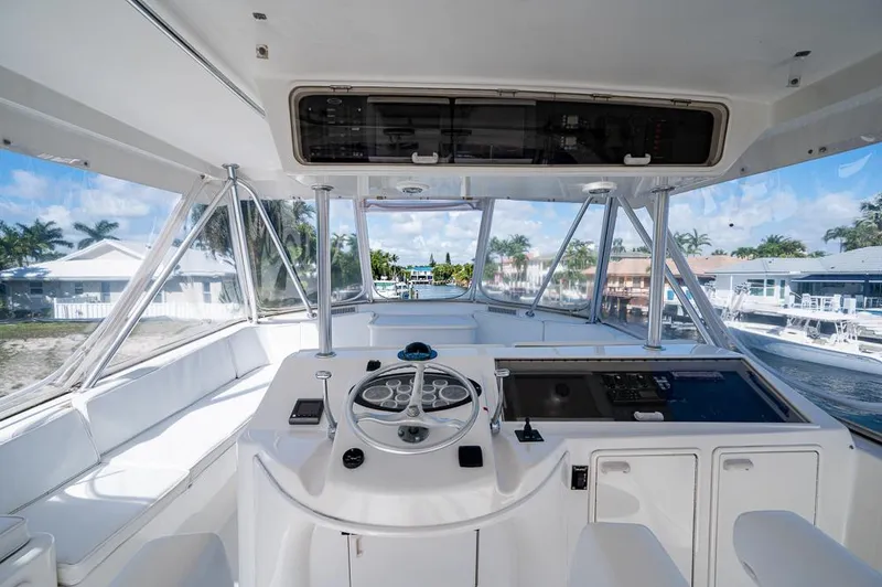 Slide: The Image of 1999 Ocean Yachts 60 Convertible helm with panoramic marina view. - 44