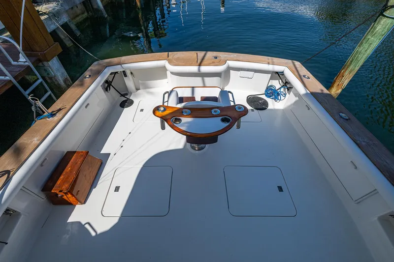 Slide: The Image of 1999 Ocean Yachts 60 Convertible fishing deck with rod holders and storage compartments. - 16