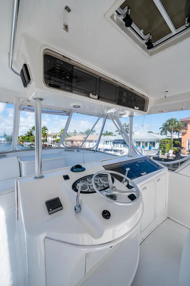 Slide: The Image of 1999 Ocean Yachts 60 Convertible yacht helm with modern controls and panoramic view. - 4