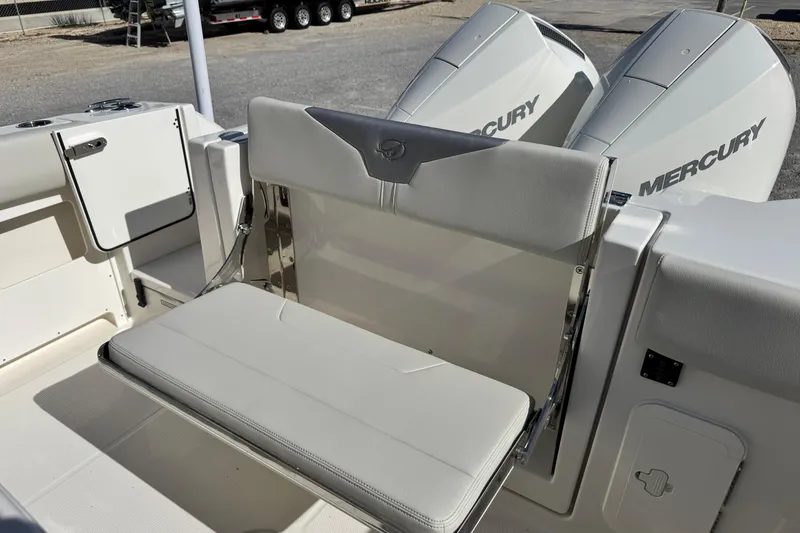Slide: The Image of 2026 Sailfish 272 CC boat with Mercury engines and foldable seating. - 11