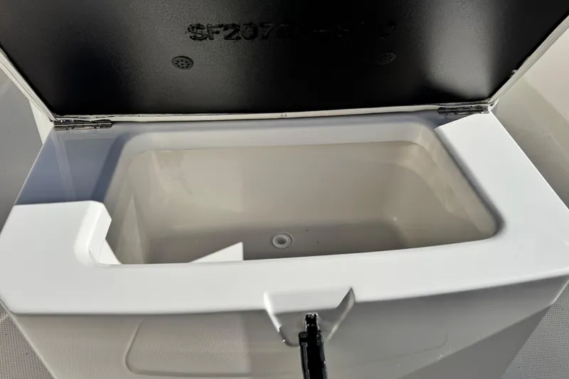 Slide: The Image of Open storage compartment on 2026 Sailfish 272 CC boat, showcasing interior space. - 33