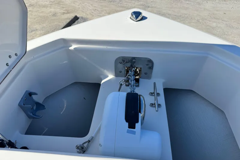 Slide: The Image of Anchor compartment of 2026 Sailfish 272 CC boat, featuring chain and cleat. - 36