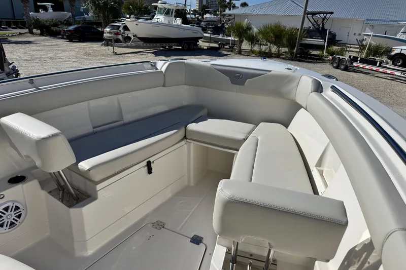 Slide: The Image of 2026 Sailfish 272 CC boat interior with white cushioned seating and modern design. - 38
