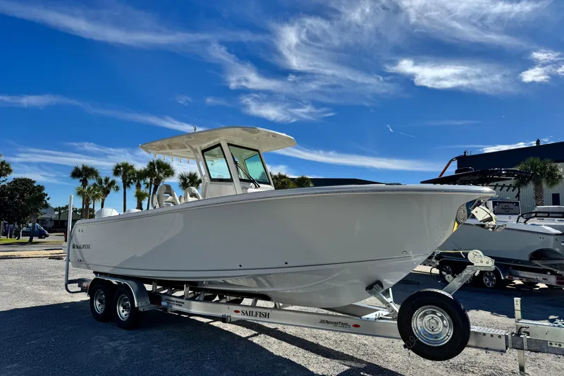 Slide: The Image of 2026 Sailfish 272 CC boat on trailer under clear blue sky. - 7