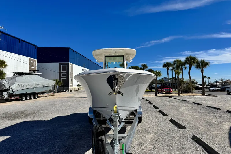 Slide: The Image of 2026 Sailfish 272 CC boat on trailer under clear blue sky. - 8