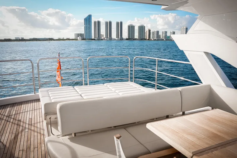 Slide: The Image of Luxurious Sunseeker 76 Yacht deck with city skyline view, 2019 model. - 13