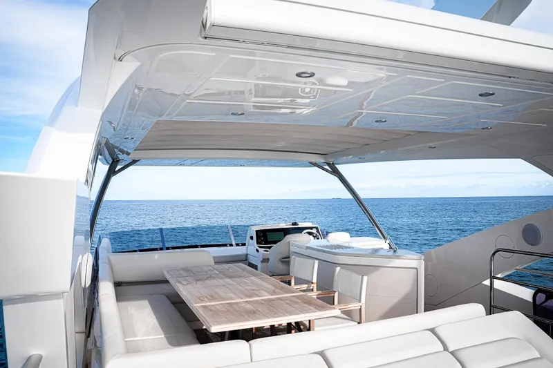Slide: The Image of Luxurious 2019 Sunseeker 76 Yacht deck with seating, ocean view, and modern design. - 14
