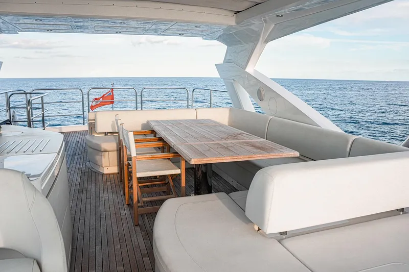 Slide: The Image of Luxurious Sunseeker 76 Yacht 2019 with elegant outdoor seating and ocean view. - 17