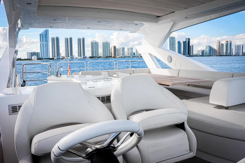 Slide: The Image of Luxurious 2019 Sunseeker 76 Yacht interior with city skyline view. - 19