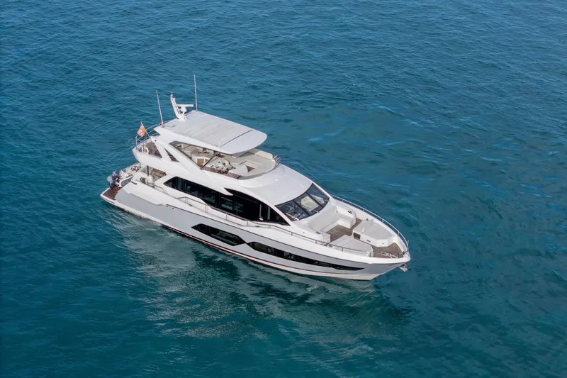 Slide: The Image of Luxurious 2019 Sunseeker 76 Yacht cruising on open blue waters. - 2