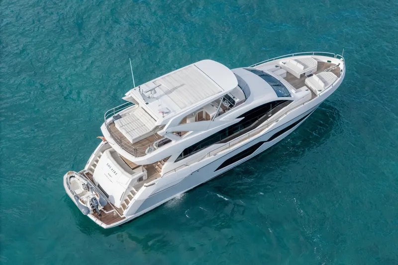 Slide: The Image of 2019 Sunseeker 76 Yacht cruising on clear blue water, aerial view. - 3