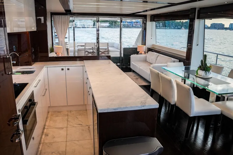 Slide: The Image of Luxurious interior of 2019 Sunseeker 76 Yacht with modern kitchen and elegant dining area. - 34