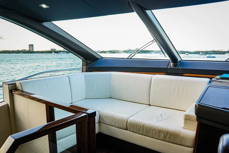Slide: The Image of Luxurious interior of 2019 Sunseeker 76 Yacht with white seating and ocean view. - 35