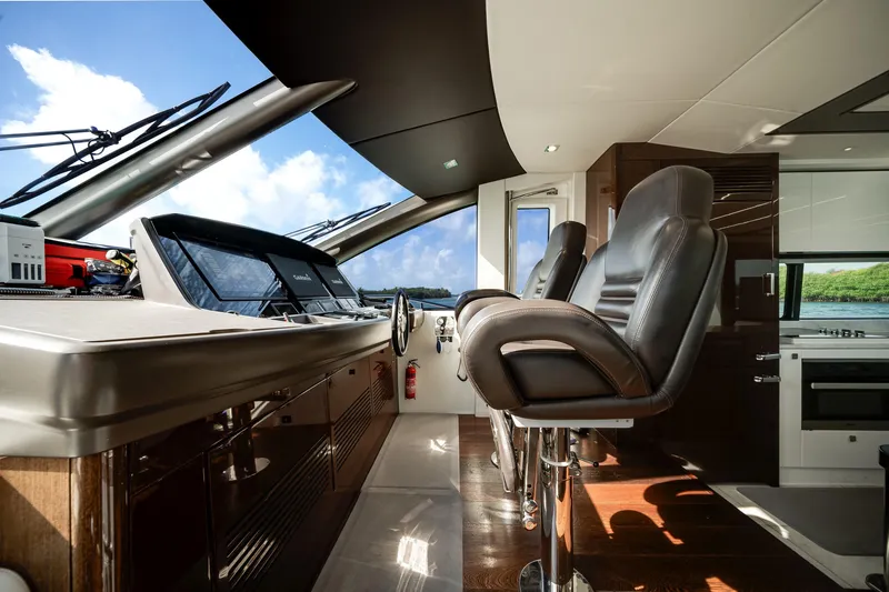 Slide: The Image of Luxurious interior of 2019 Sunseeker 76 Yacht with modern helm and leather seating. - 36