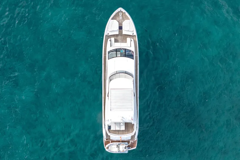 Slide: The Image of Overhead view of 2019 Sunseeker 76 Yacht on clear blue water. - 4