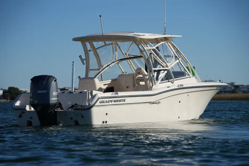 Slide: The Image of 2016 Grady-White Freedom 255 boat on water, featuring Yamaha 300 engine. - 11