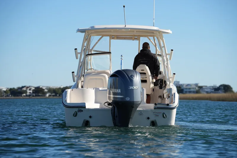 Slide: The Image of 2016 Grady-White Freedom 255 boat with Yamaha 300 engine on water. - 14
