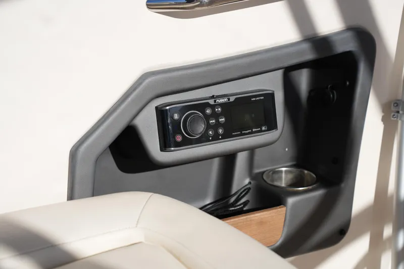 Slide: The Image of Control panel on 2016 Grady-White Freedom 255 boat, featuring a Fusion audio system. - 24