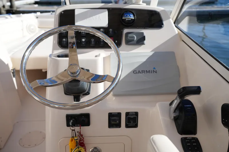 Slide: The Image of 2016 Grady-White Freedom 255 boat dashboard with Garmin navigation system. - 27