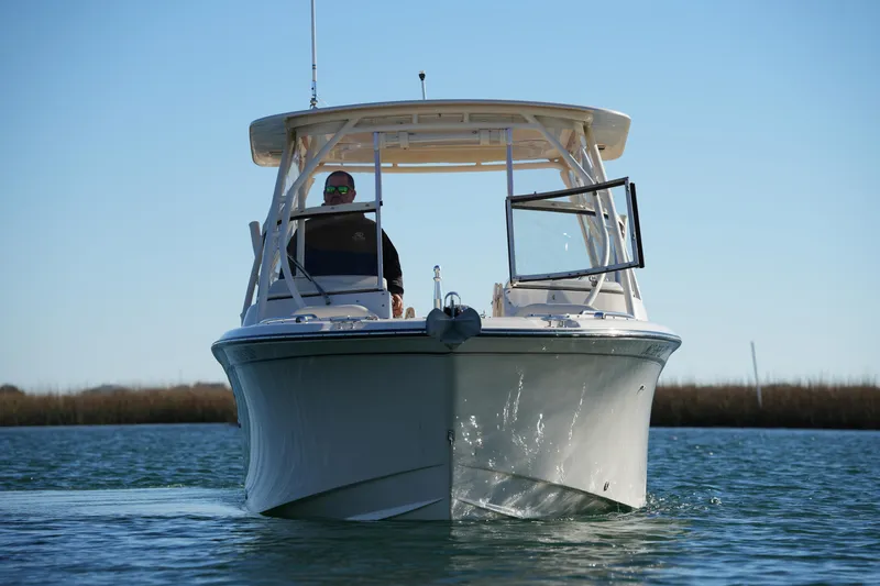 Slide: The Image of 2016 Grady-White Freedom 255 boat cruising on calm water. - 3