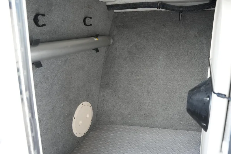 Slide: The Image of Interior storage compartment of 2016 Grady-White Freedom 255 boat, featuring carpeted walls and metal flooring. - 36