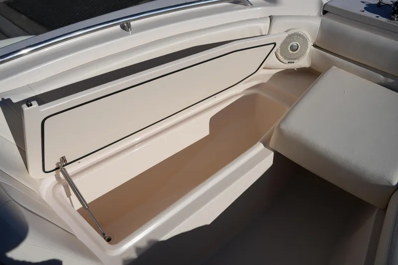 Slide: The Image of 2016 Grady-White Freedom 255 boat interior storage compartment with open lid. - 39