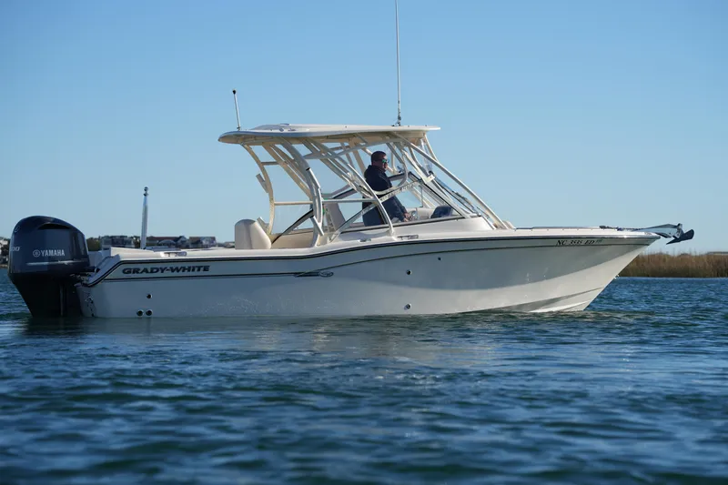 Slide: The Image of 2016 Grady-White Freedom 255 boat on water, side view with Yamaha engine. - 9