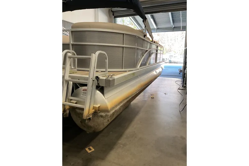 Slide: The Image of 2019 Bennington SX 23 SSRXP pontoon boat in storage facility. - 4