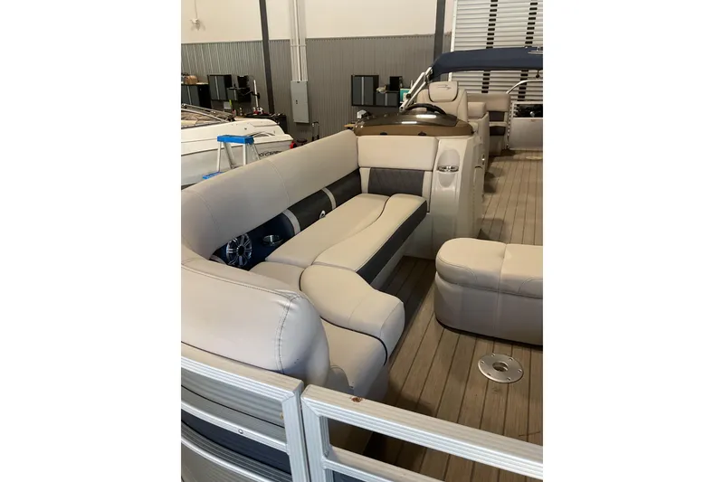 Slide: The Image of 2019 Bennington SX 23 SSRXP pontoon boat interior with plush seating and modern design. - 8