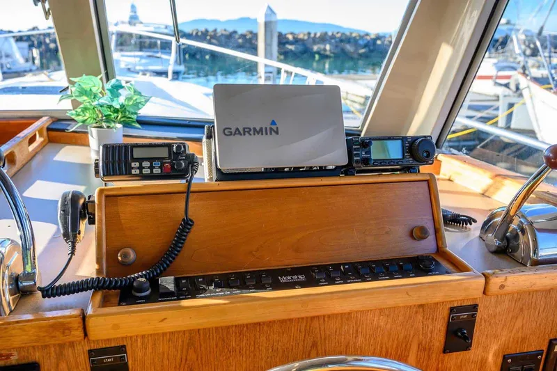 Slide: The Image of 1997 Mainship 350 Trawler helm with Garmin navigation and communication equipment. - 32