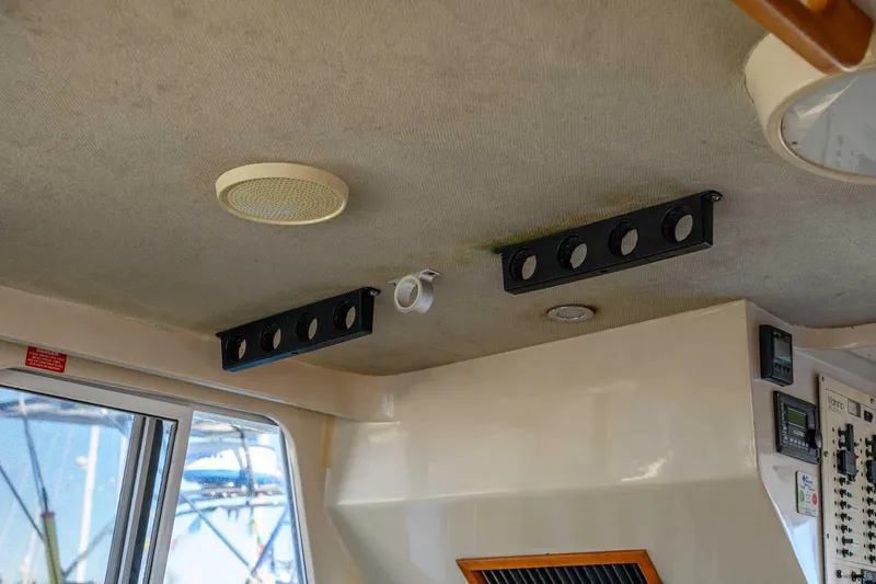 Slide: The Image of Interior ceiling of a 1997 Mainship 350 Trawler with speakers and controls. - 39