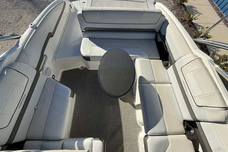 Slide: The Image of 2019 Formula 270 Bowrider interior with spacious seating and central table. - 13