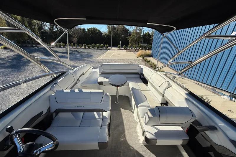 Slide: The Image of 2019 Formula 270 Bowrider interior with white seating and sleek design. - 14