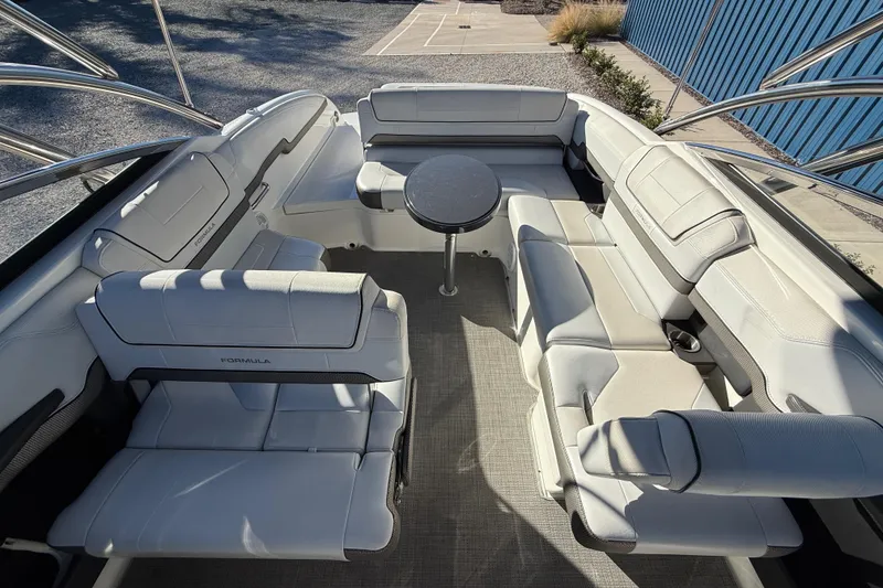 Slide: The Image of 2019 Formula 270 Bowrider interior with white seating and round table. - 16