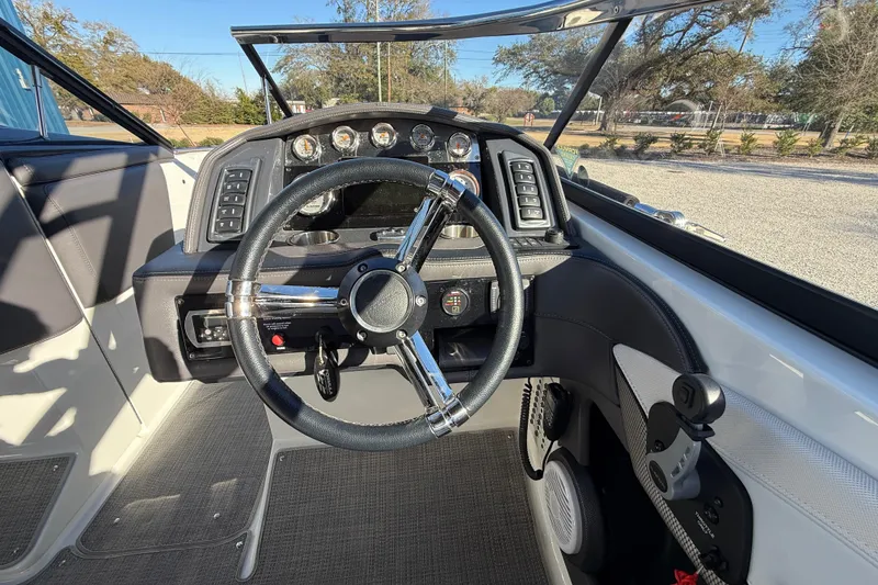 Slide: The Image of 2019 Formula 270 Bowrider dashboard with steering wheel and control panel. - 17
